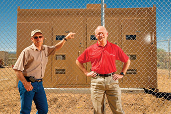 Gallup Joint Utilities Executive Director Lance Allgood and Ccity Councilor Alan Landavazo stand in front of what will soon be a new power transfer station in Gallup. © 2011 Gallup Independent / Brian Leddy